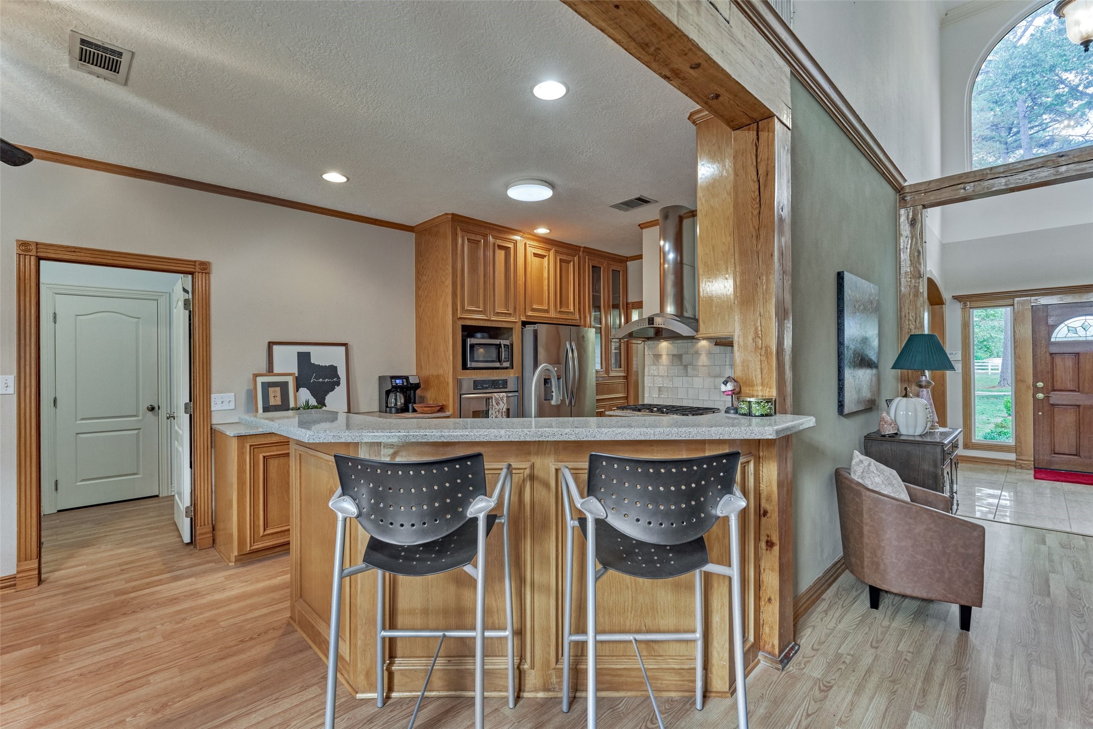 Breakfast bar open to breakfast and living areas.