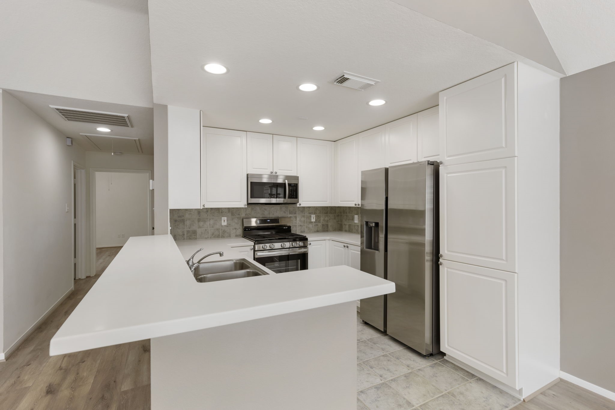 Plenty of counter space and bar space for additional seating.