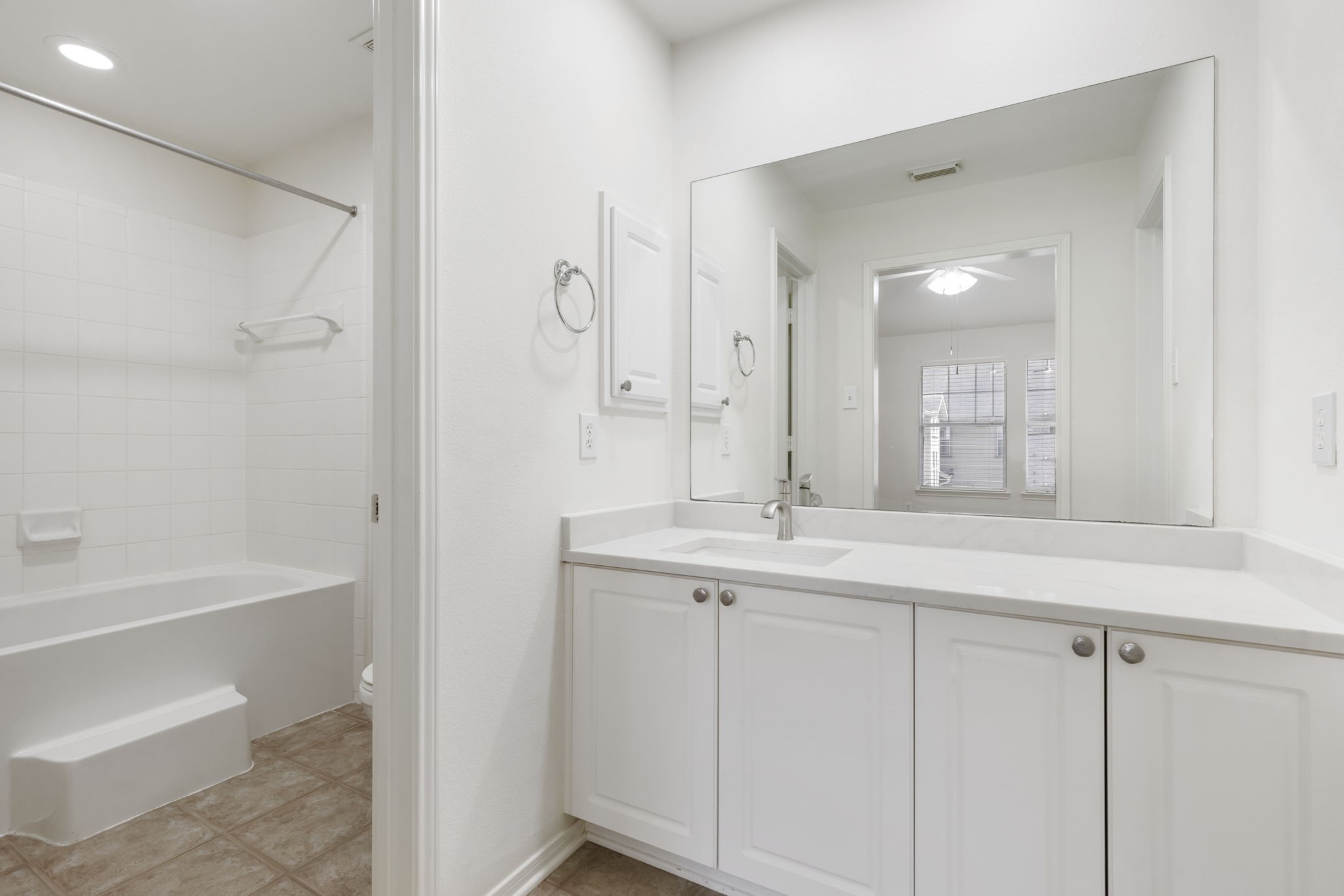 Primary bath with brand new countertops.