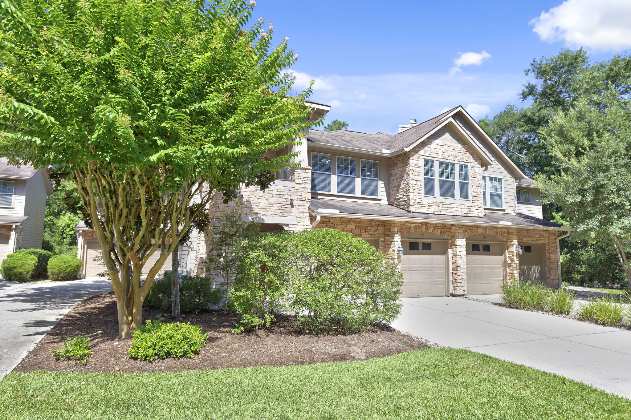 Pretty two story townhome with the garage and laundry on the first floor and living spaces on the second.