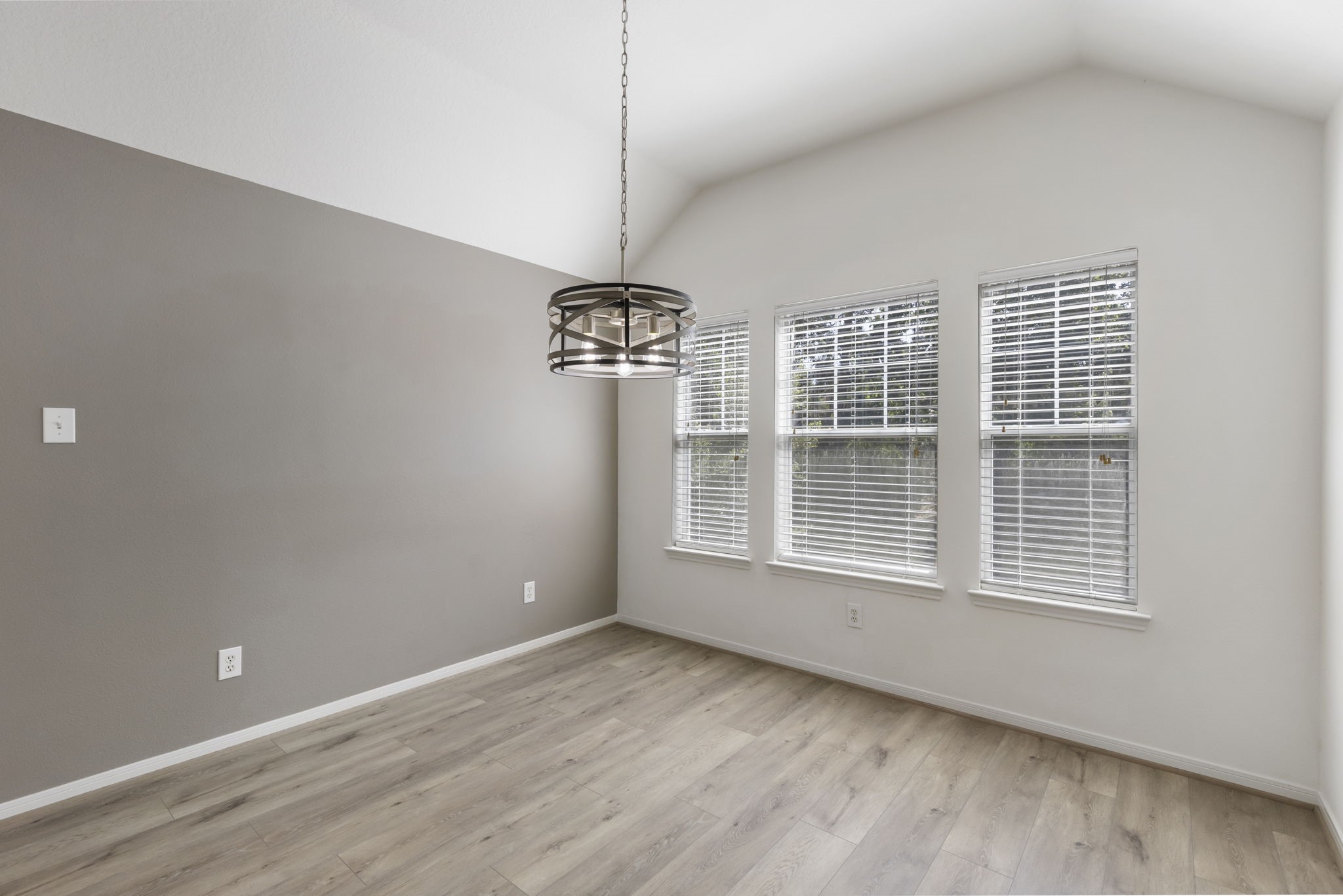 Dining area with new custom lighting.
