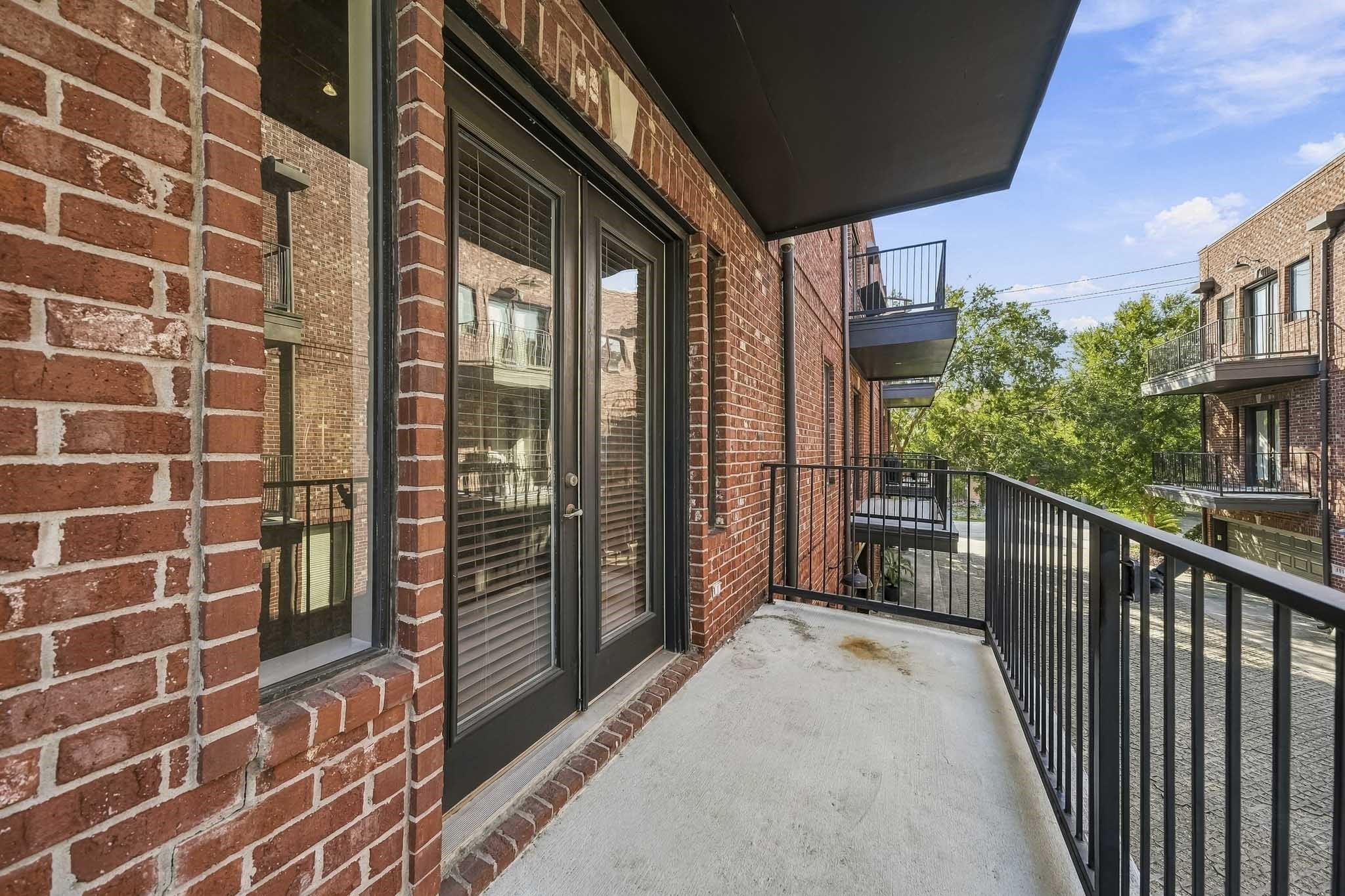 Just off the family room, this inviting covered balcony offers a private outdoor retreat and is one of three balconies throughout the home. An ideal setting for morning coffee, alfresco dining, or relaxing in the evening breeze, it extends the living space outdoors with comfort and style.