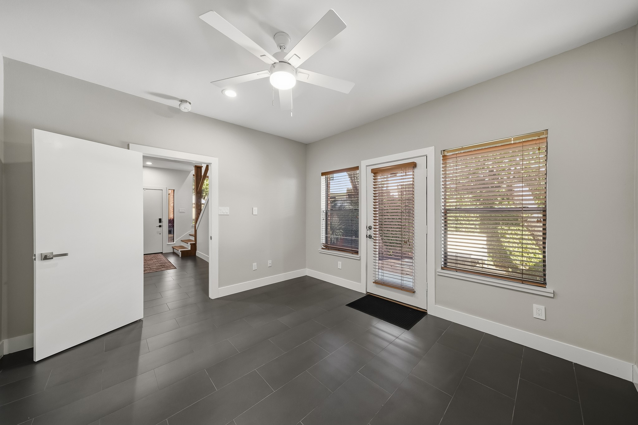 A private patio extends from the third bedroom, offering a secluded outdoor escape and an added touch of luxury to this versatile space.