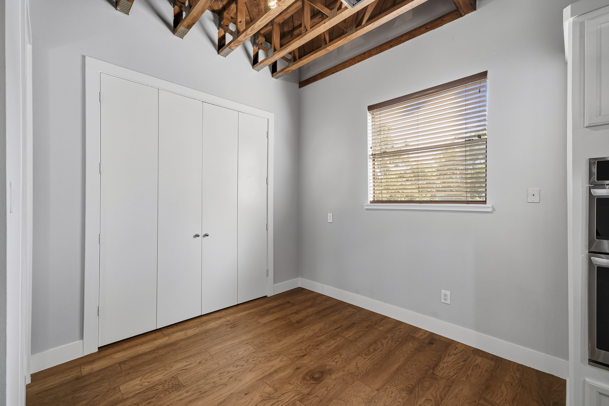The dining area offers an inviting setting for memorable meals and special occasions, seamlessly positioned near the kitchen and family room for a natural flow and effortless entertaining.