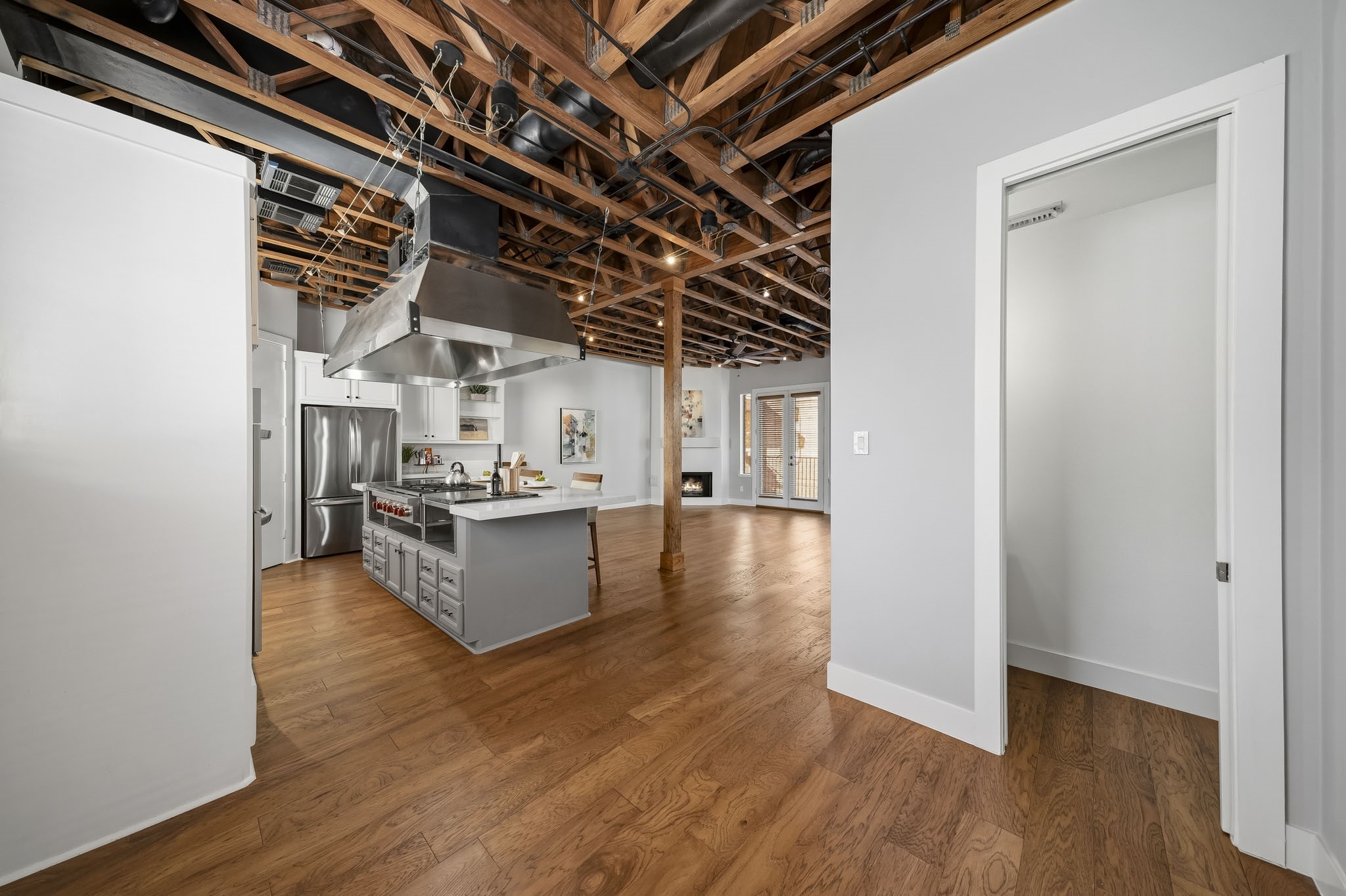 The dining area enjoys views of the kitchen and family room as well as easy access to a well-appointed half bath, offering added comfort and convenience for residents and guests alike.