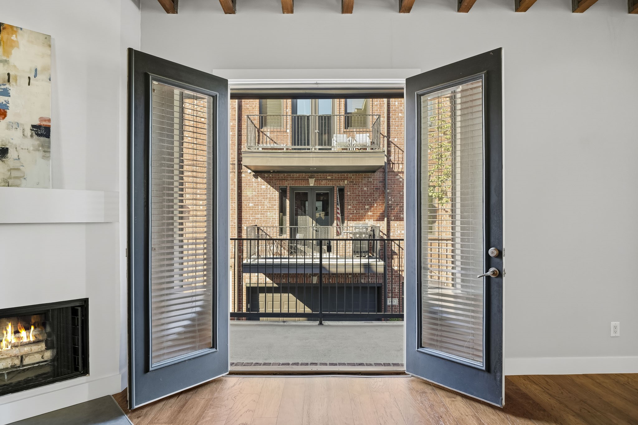 Elegant eight-foot French doors open from the family room to a covered balcony, seamlessly extending the living space outdoors. Complete with a gas connection for grilling, this inviting retreat offers the perfect setting for alfresco dining and entertaining.