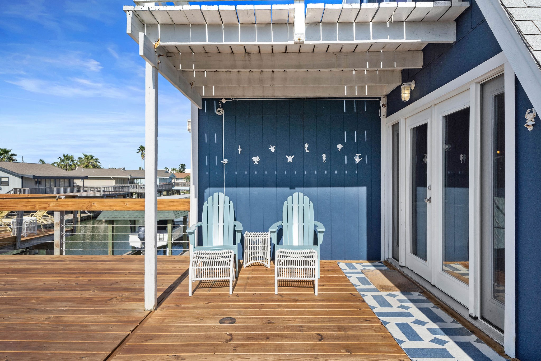 Charming waterfront deck with a pergola, offering a perfect spot to relax and enjoy the view. Charming waterfront deck with a pergola, offering a perfect spot to relax and enjoy the view.