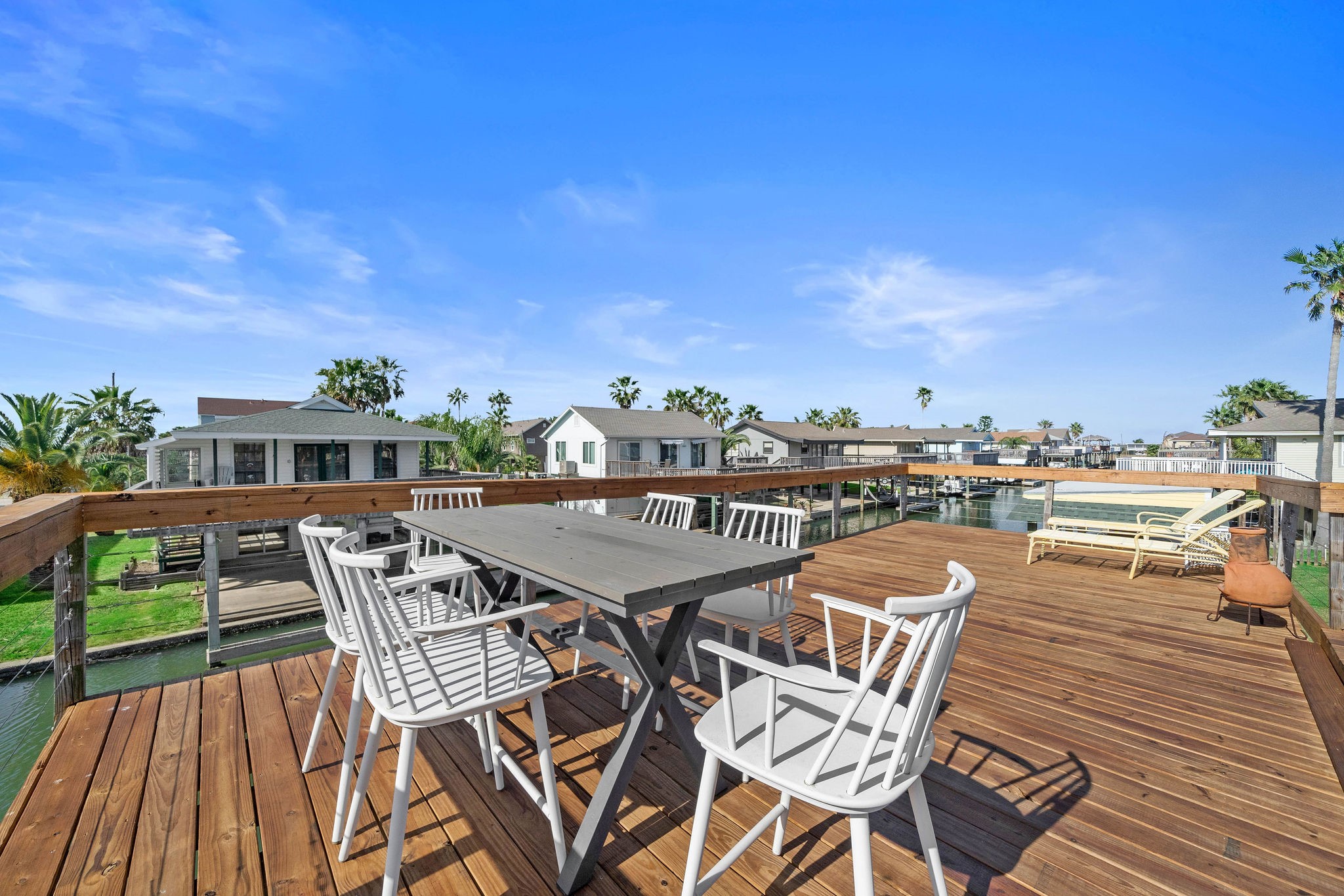 Spacious waterfront deck perfect for entertaining, with stunning views and ample seating. Spacious waterfront deck perfect for entertaining, with stunning views and ample seating.
