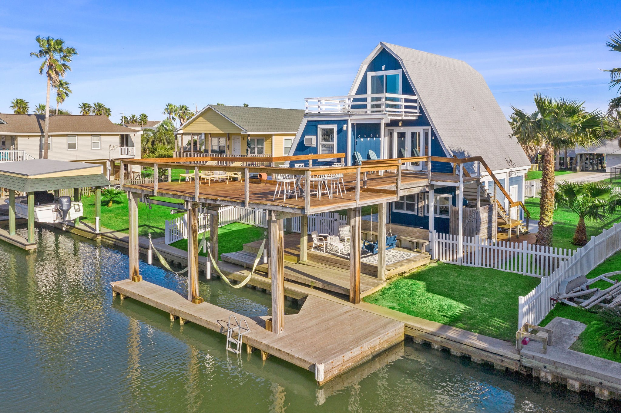Charming waterfront A-frame home with expansive deck, private dock, and picturesque canal views, perfect for enjoying coastal living. Charming waterfront A-frame home with expansive deck, private dock, and picturesque canal views, perfect for enjoying coastal living.