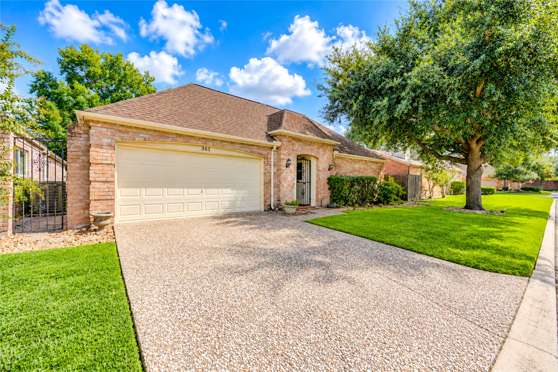 Charming brick home with a spacious two-car garage, water and mowing are included in dues. New lighting in bedrooms and bathrooms.