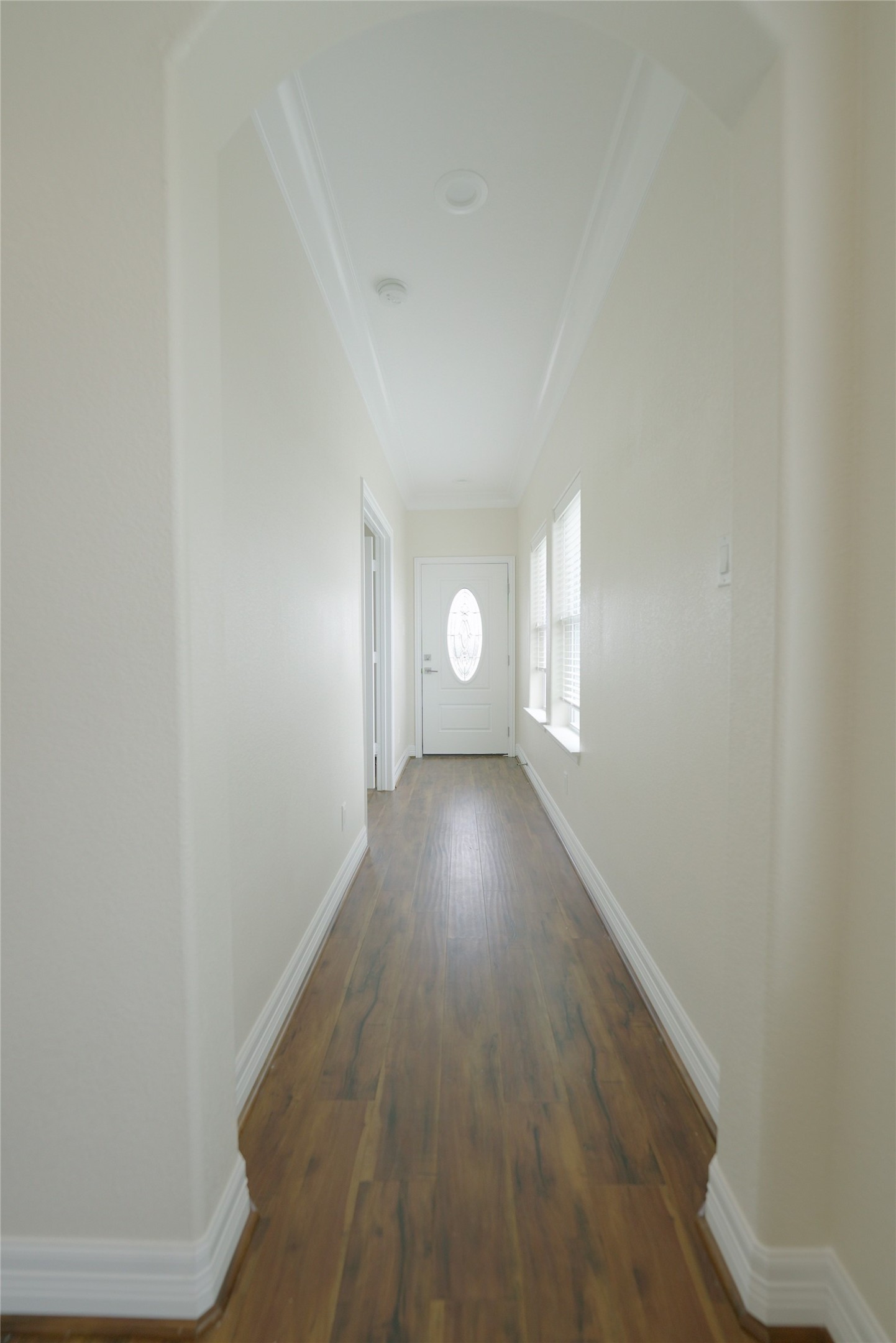 Charming top-floor hallway featuring elegant hardwood floors. Currently tenant-occupied.