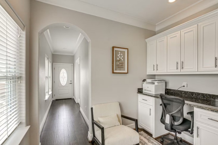 Stylish and functional furnished work station with elegant cabinetry and a sleek workspace, perfect for productivity.