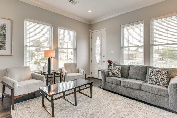 1013 10th A Charming living room with ample natural light, stylish furnishings, and cozy seating, perfect for relaxation. 1013 10th A Charming living room with ample natural light, stylish furnishings, and cozy seating, perfect for relaxation.