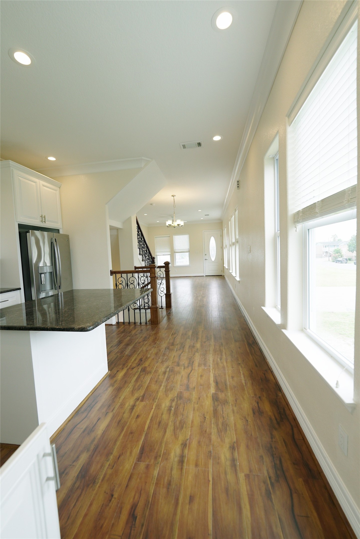 Second-level unit featuring elegant hardwood floors, recessed lighting, and abundant natural light. Currently tenant occupied.