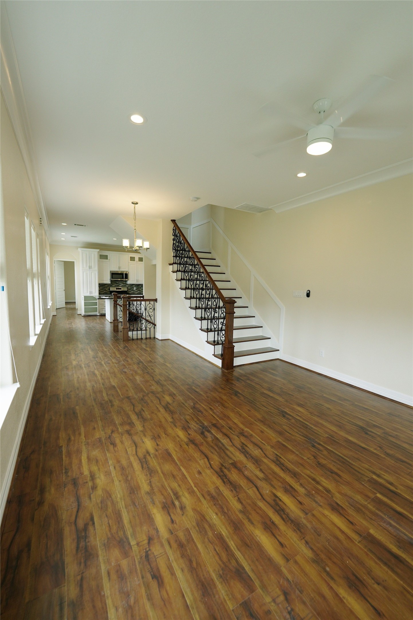 Spacious open living area featuring stunning hardwood floors, currently tenant-occupied.