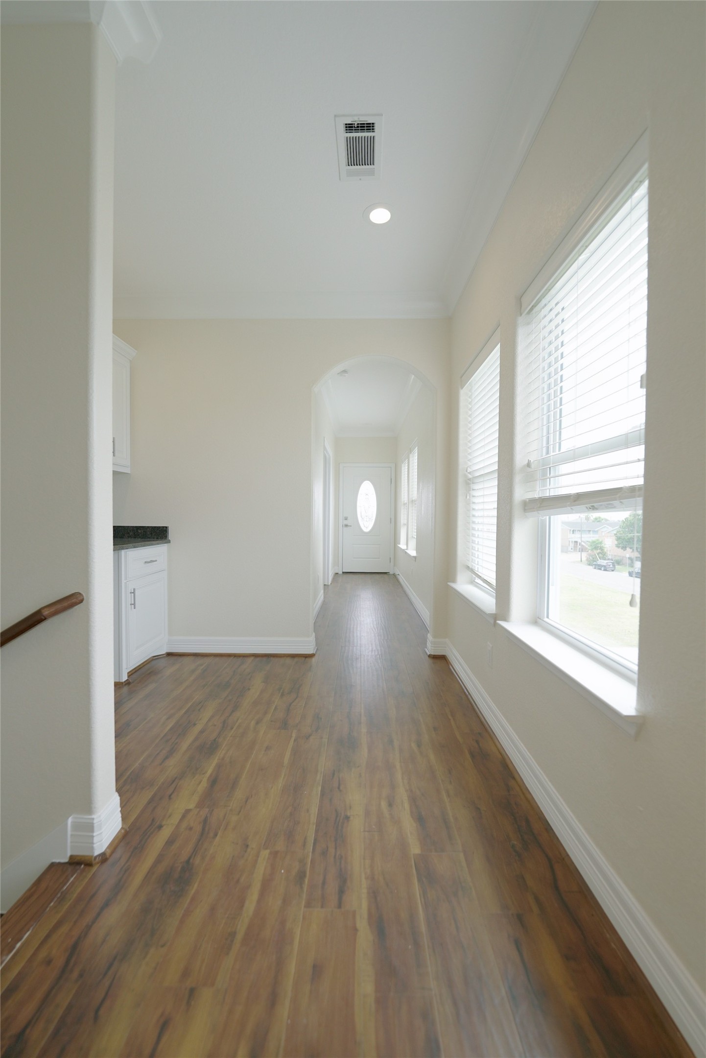 Top-level hallway featuring stunning hardwood floors, currently tenant-occupied.