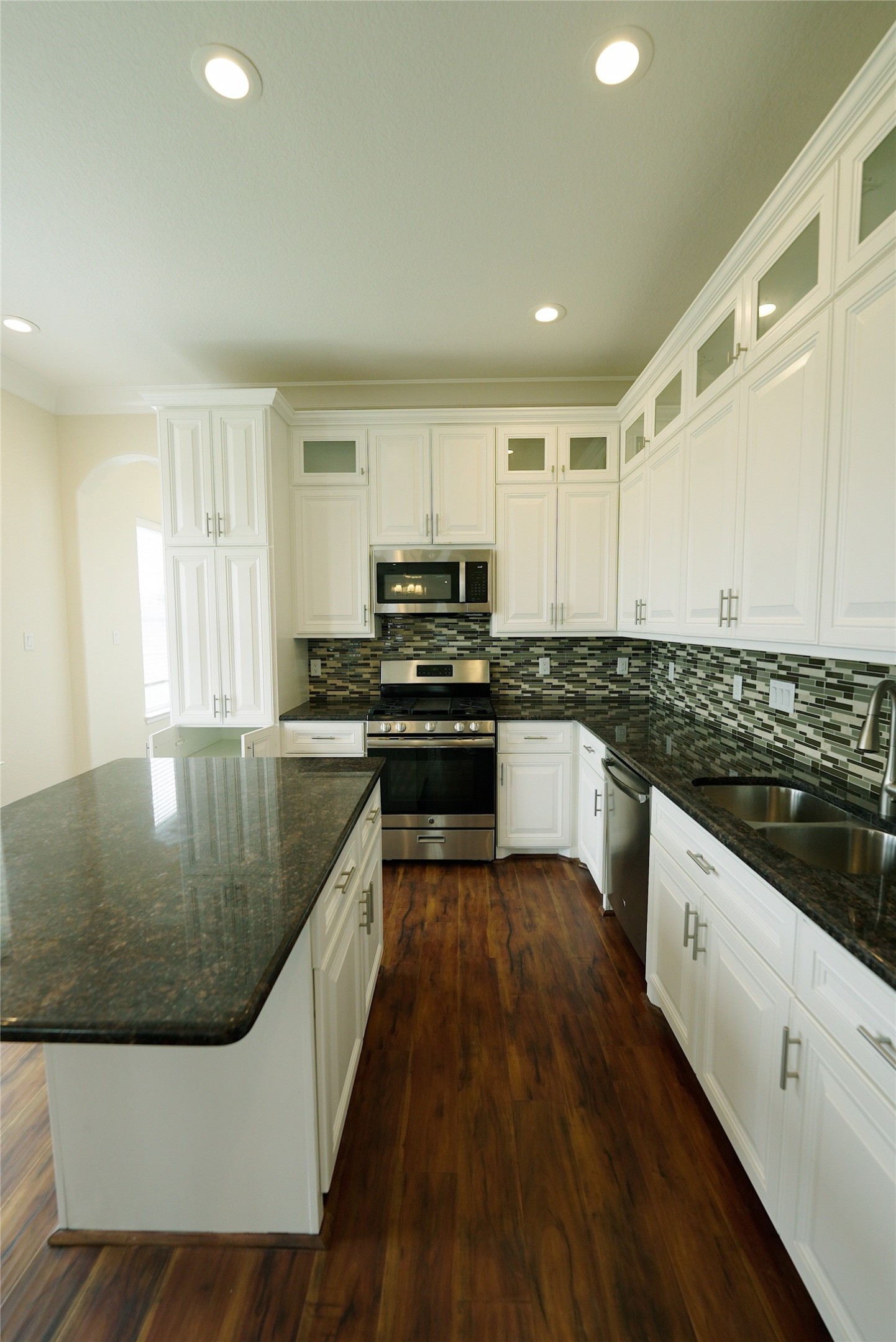 Elegant kitchen with a spacious island and ample storage, perfect for culinary enthusiasts. Currently tenant occupied.