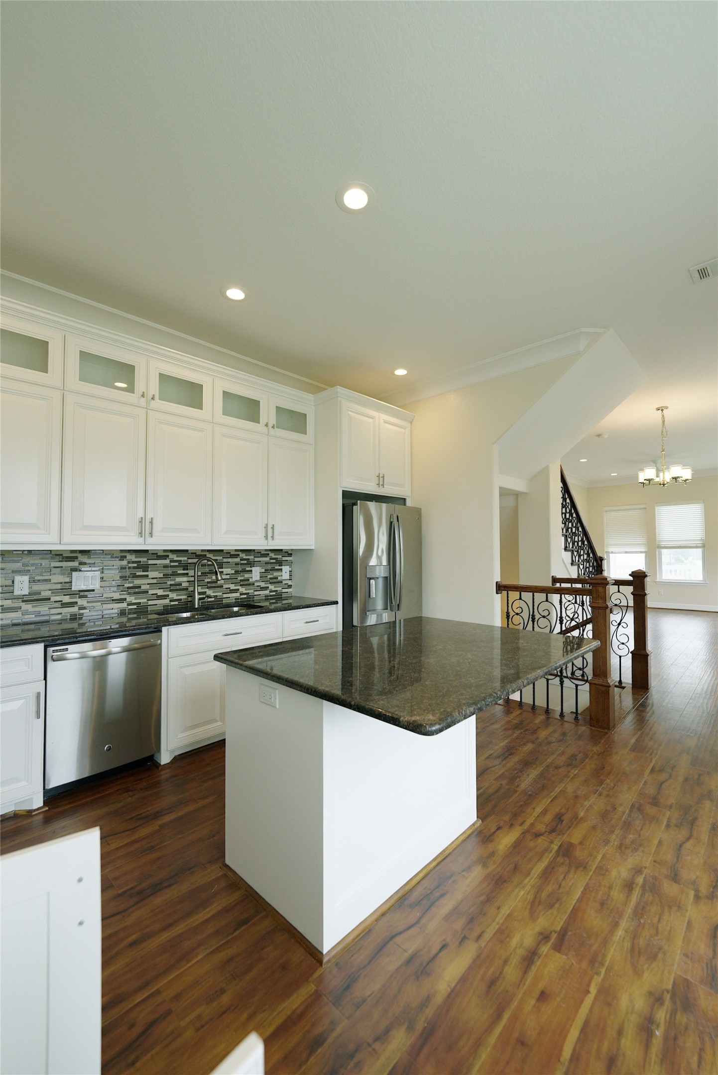 Stunning kitchen with elegant hardwood floors and modern finishes. Currently tenant occupied.