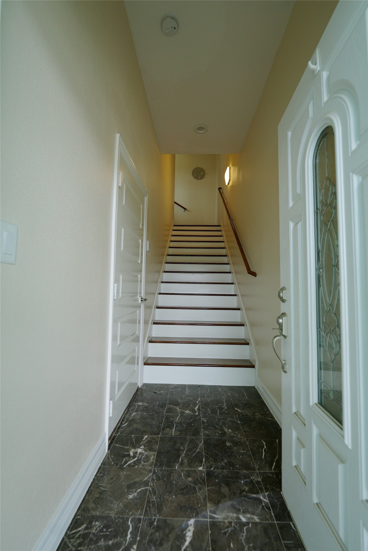 Elegant marble floors and a welcoming staircase enhance the grand entrance of 1013 10th B Street. Currently tenant occupied.