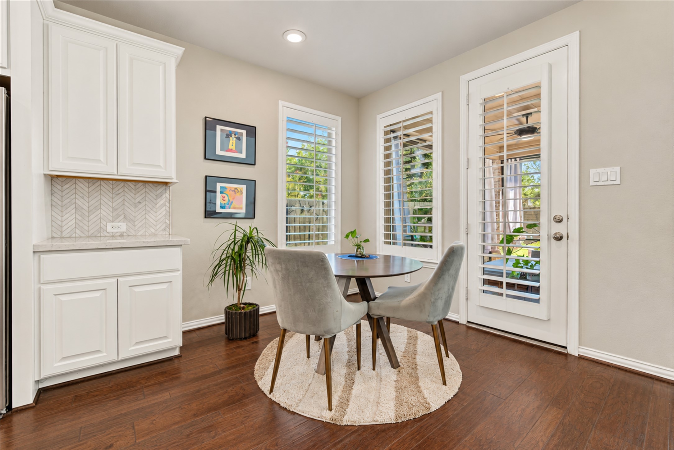 Abundant windows fill the home with natural light, creating a bright, airy atmosphere that flows effortlessly throughout the living spaces.