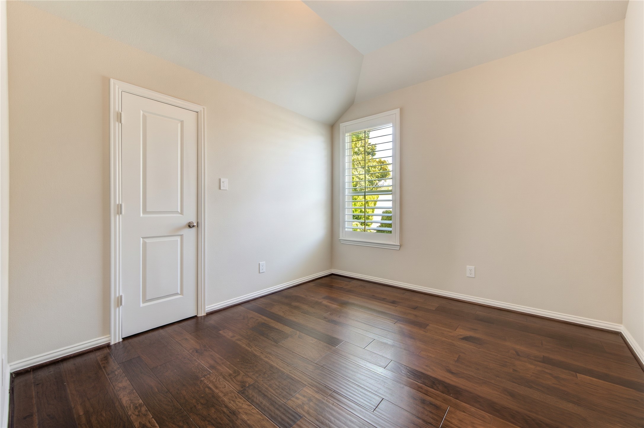 The upstairs secondary bedroom offers a comfortable, versatile space.