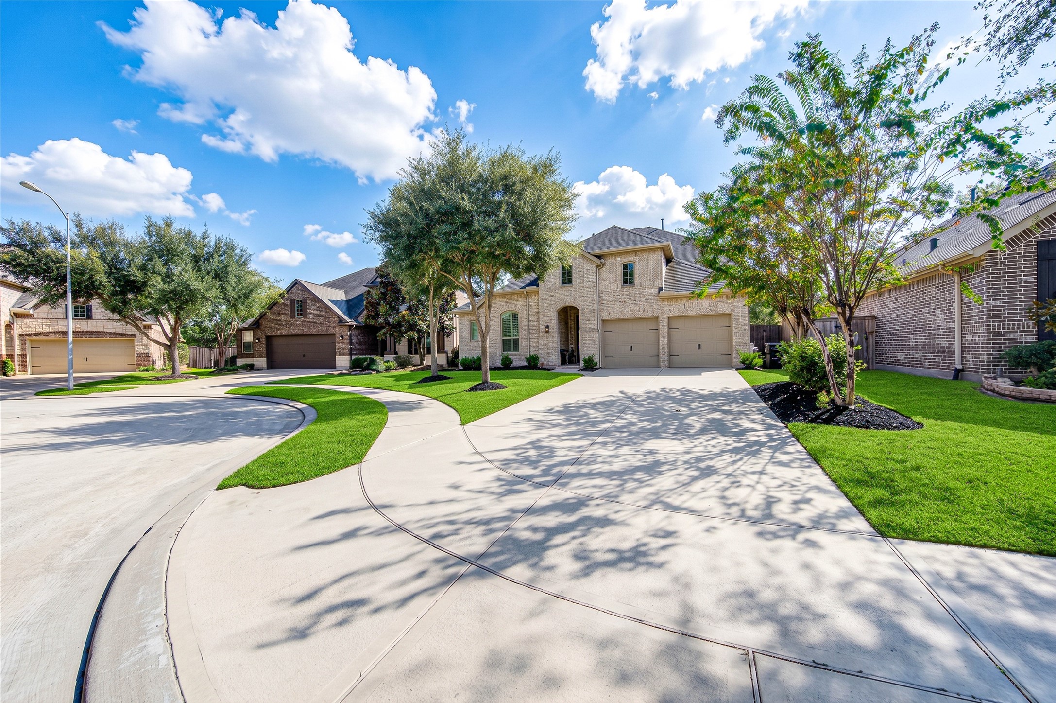 The homes striking brick surround creates a grand, welcoming first impression, complemented by a two-car garage and a desirable cul-de-sac location.