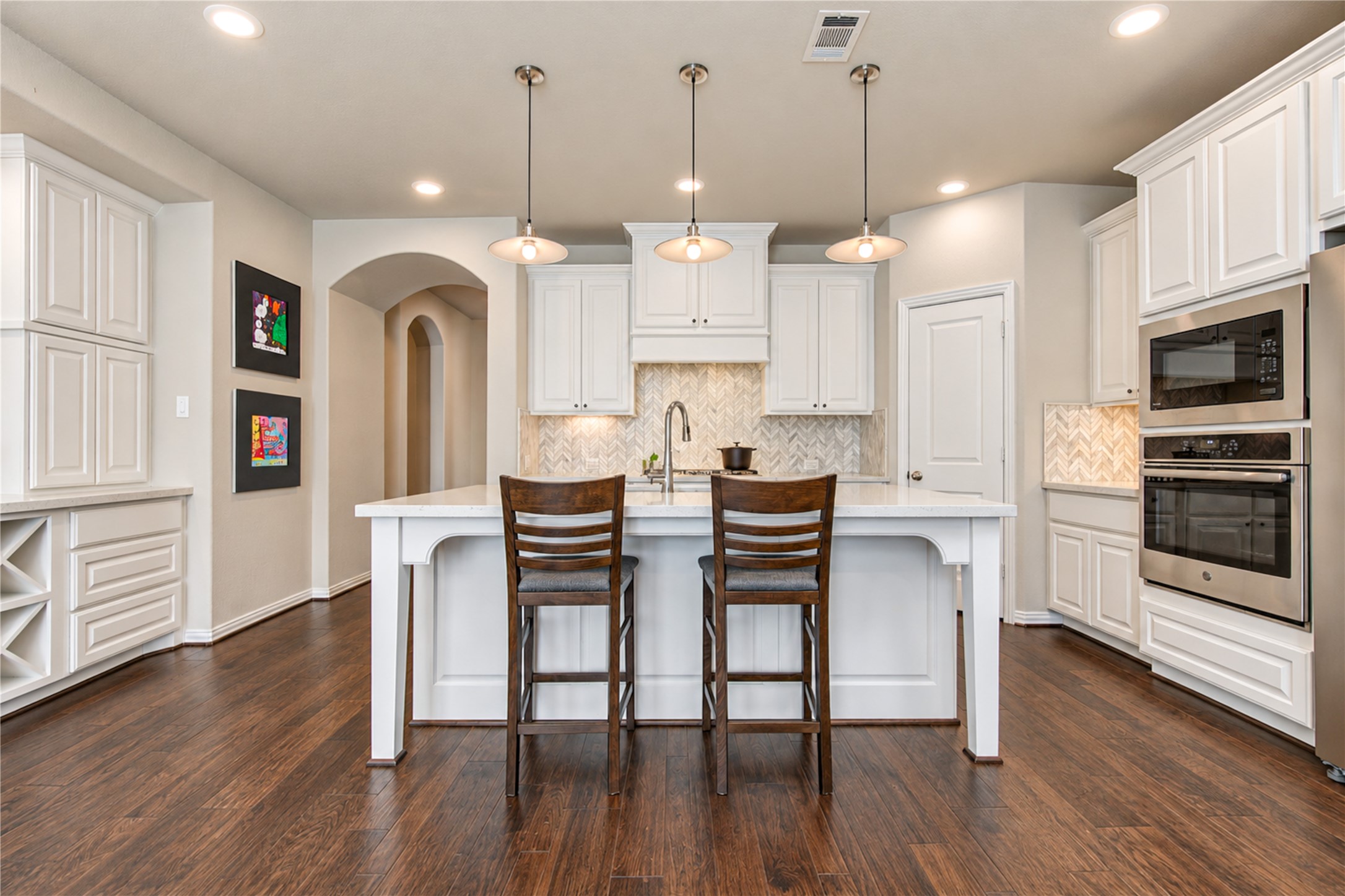 Abundant windows fill the home with natural light, creating a bright, airy atmosphere that flows effortlessly throughout the living spaces.