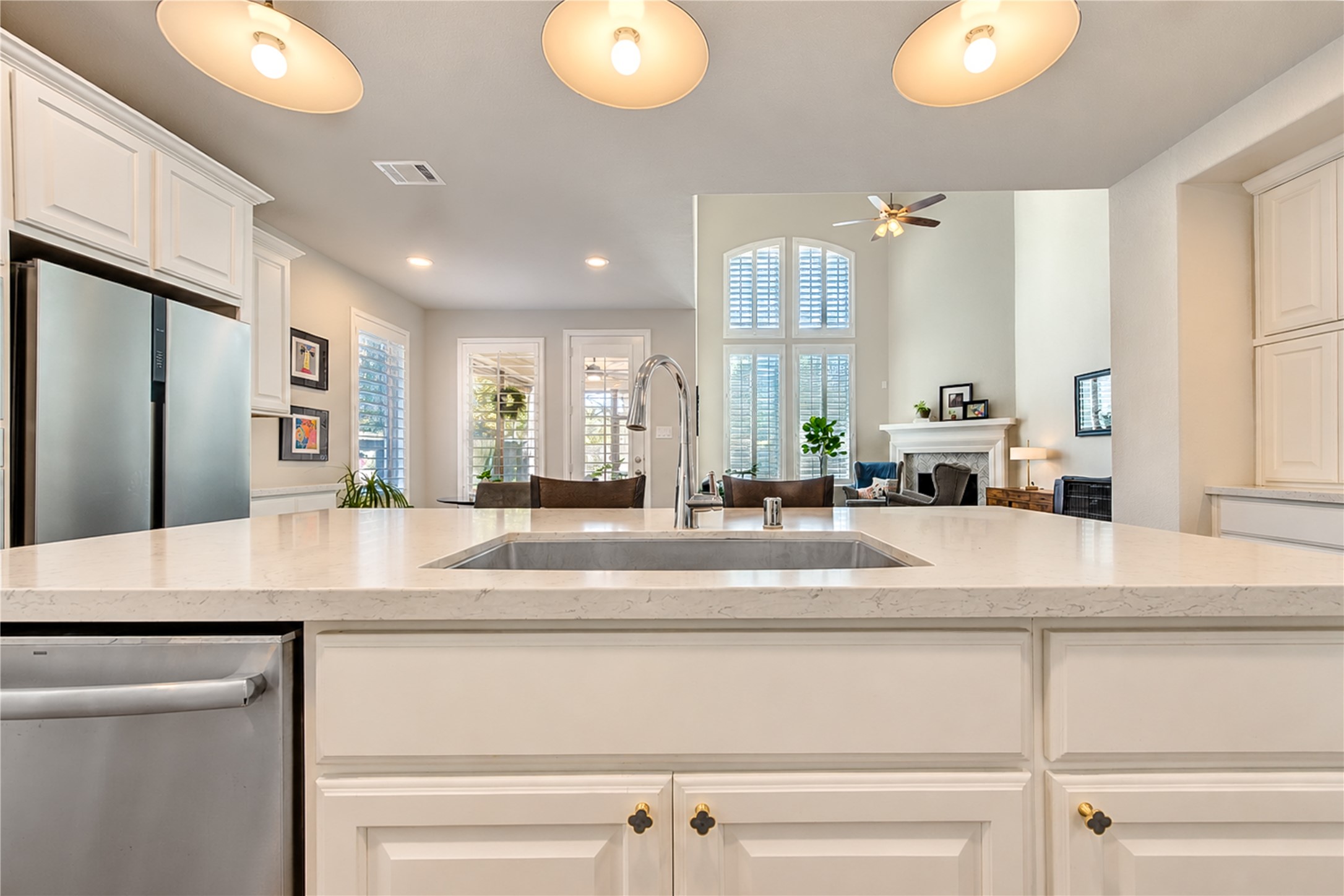 The open-concept floor plan is ideal for entertaining, with the kitchen flowing seamlessly into the family room and breakfast area to create a welcoming space for gathering with family and friends.
