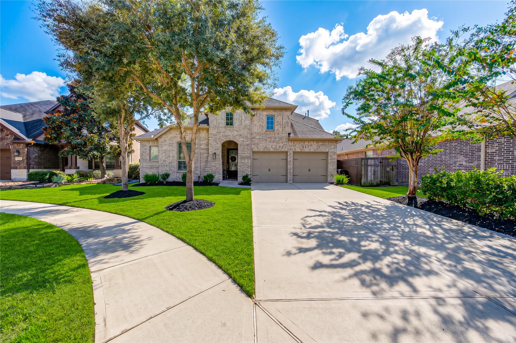 The homes striking brick surround creates a grand, welcoming first impression, complemented by a two-car garage and a desirable cul-de-sac location.