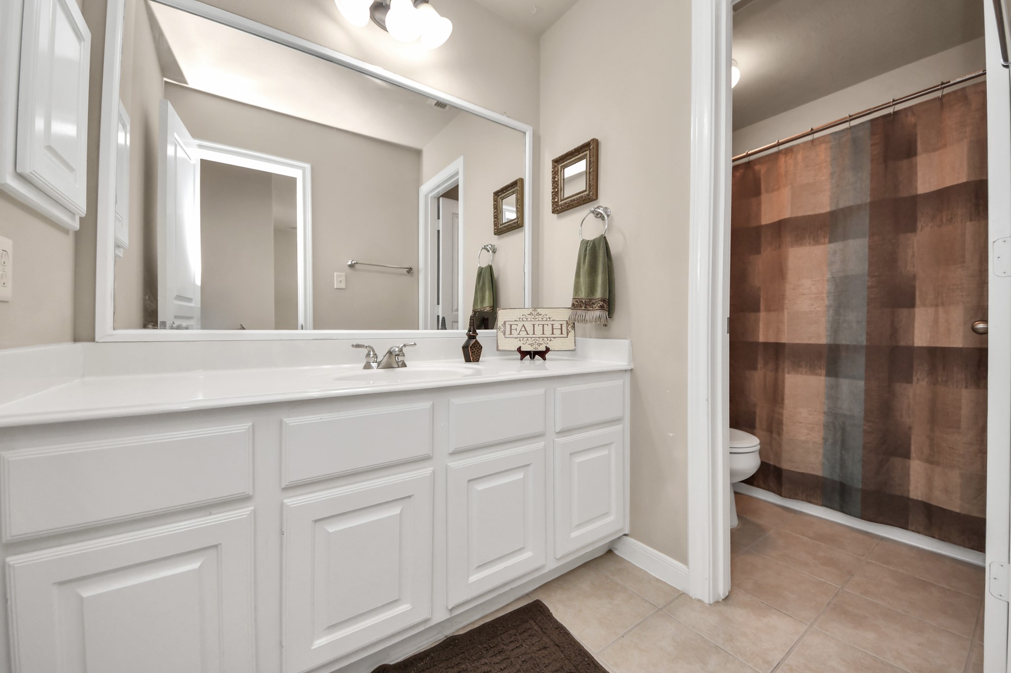One of three full baths upstairs