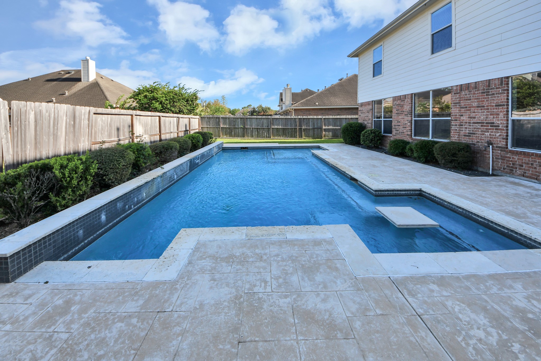 The beautiful saltwater pool has stunning water features and a built-in table and bar area, perfect for relaxing or entertaining friends and family!