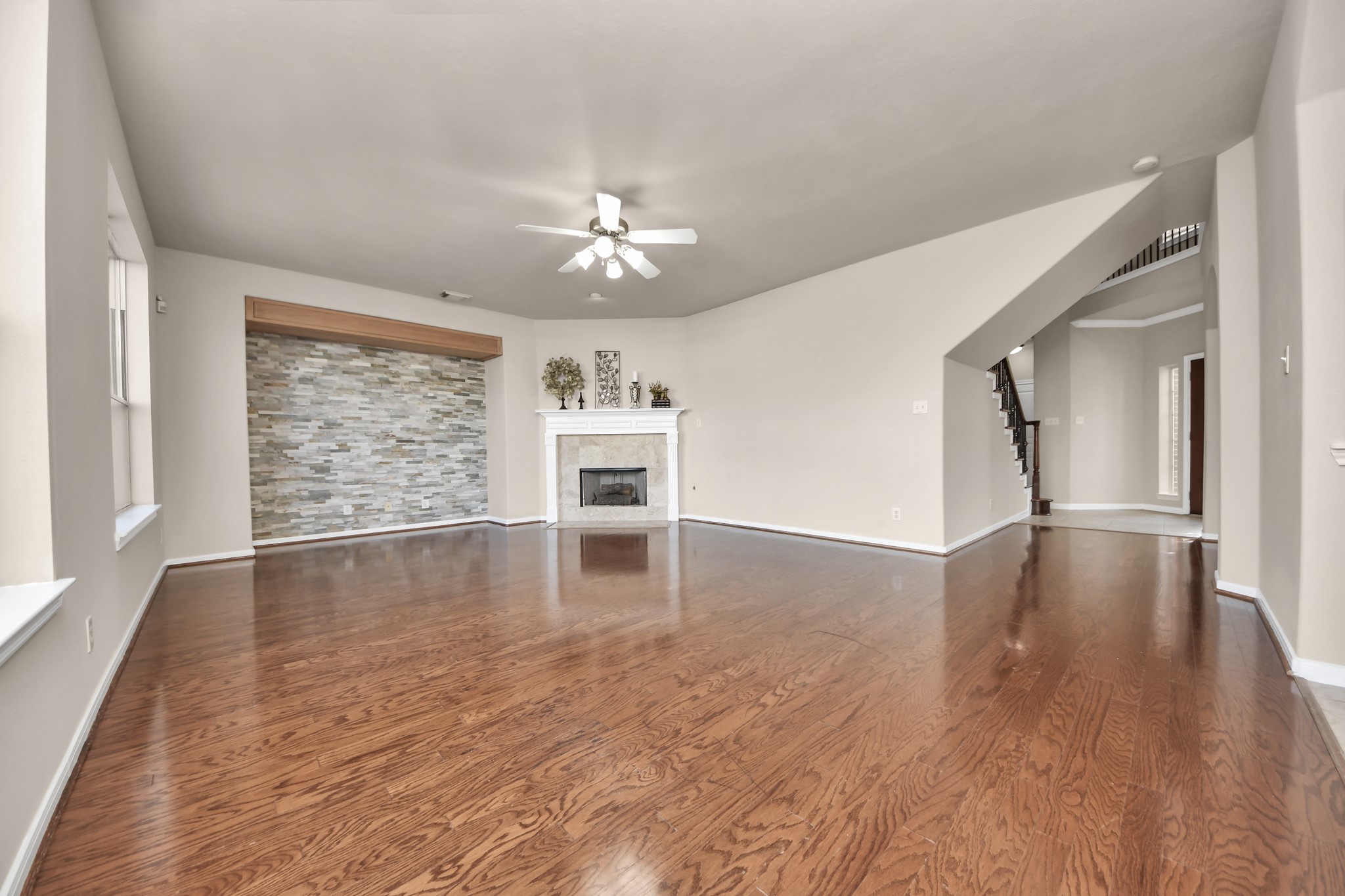A bold accent wall and a gas-log fireplace create an inviting atmosphere in this cozy family room.