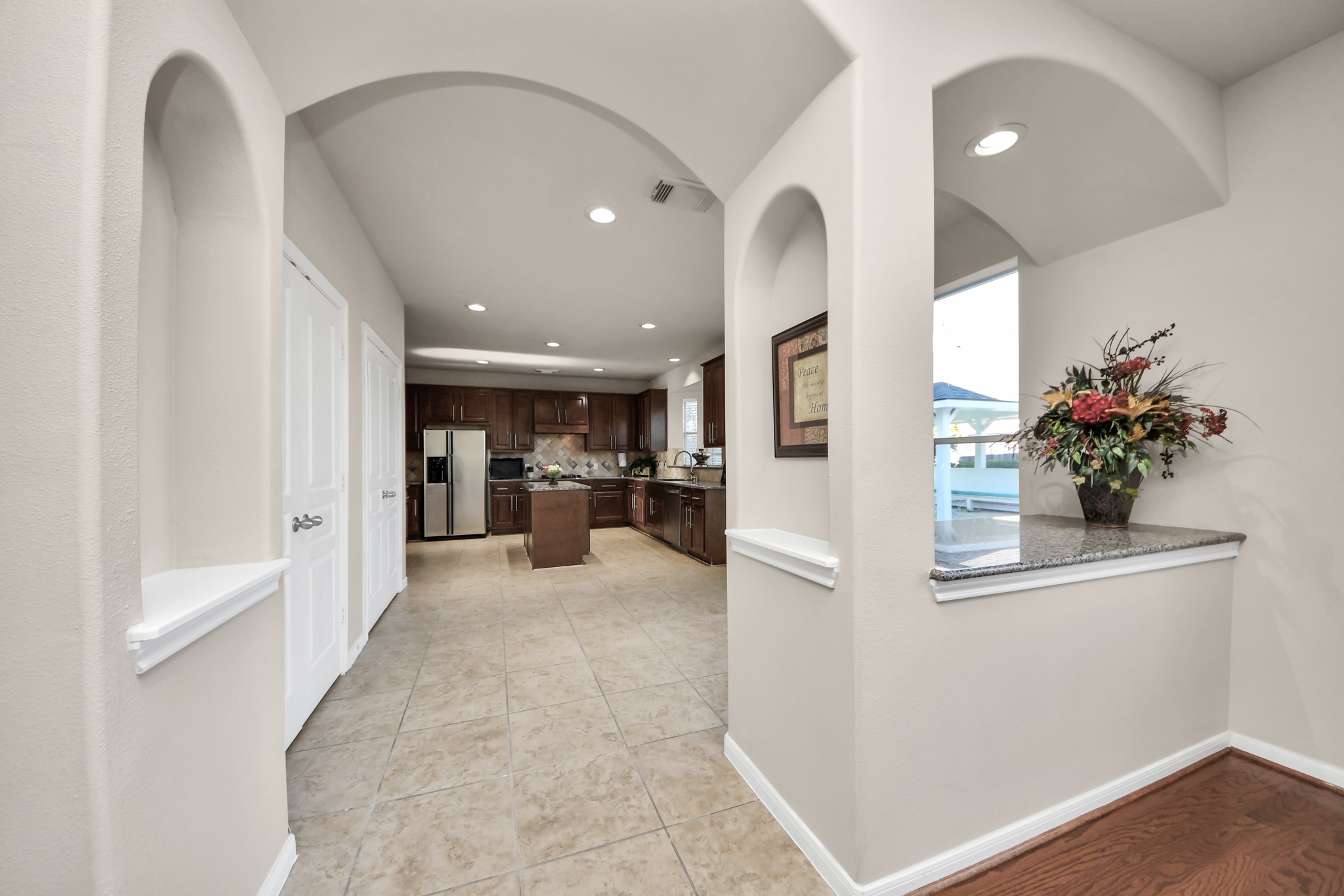 Classic insets and elegant archways contribute to the timeless charm of this beautiful home.