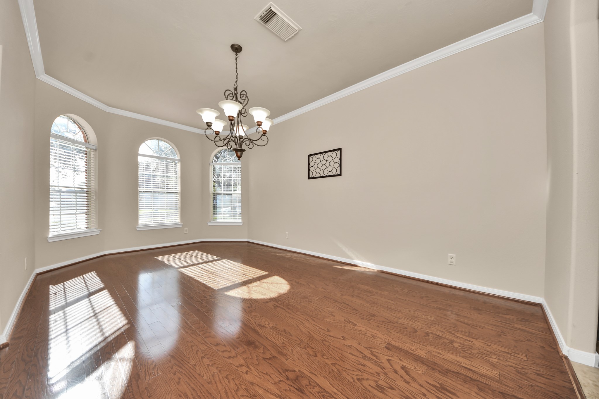The formal dining is complete with crown molding and private access to the kitchen.