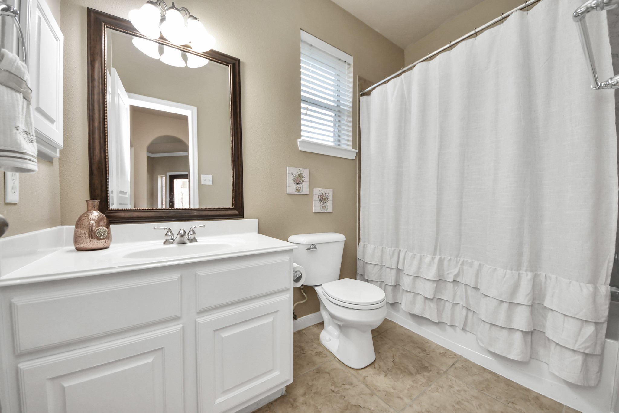 Before heading upstairs, check out the full bath conveniently located next to a generously sized bedroom, perfect for out-of-town guests, extended family, or a private mother-in-law suite!
