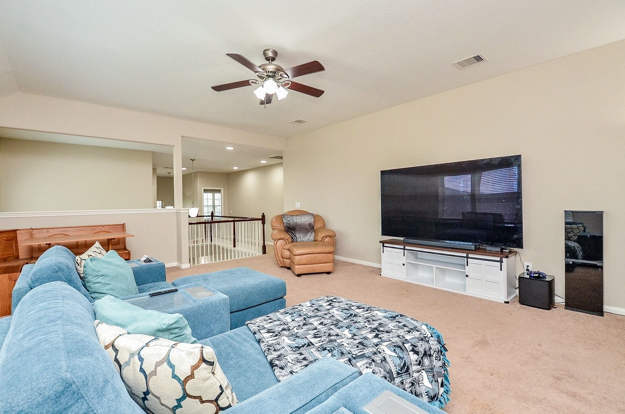 Huge game room upstairs with plenty of light.