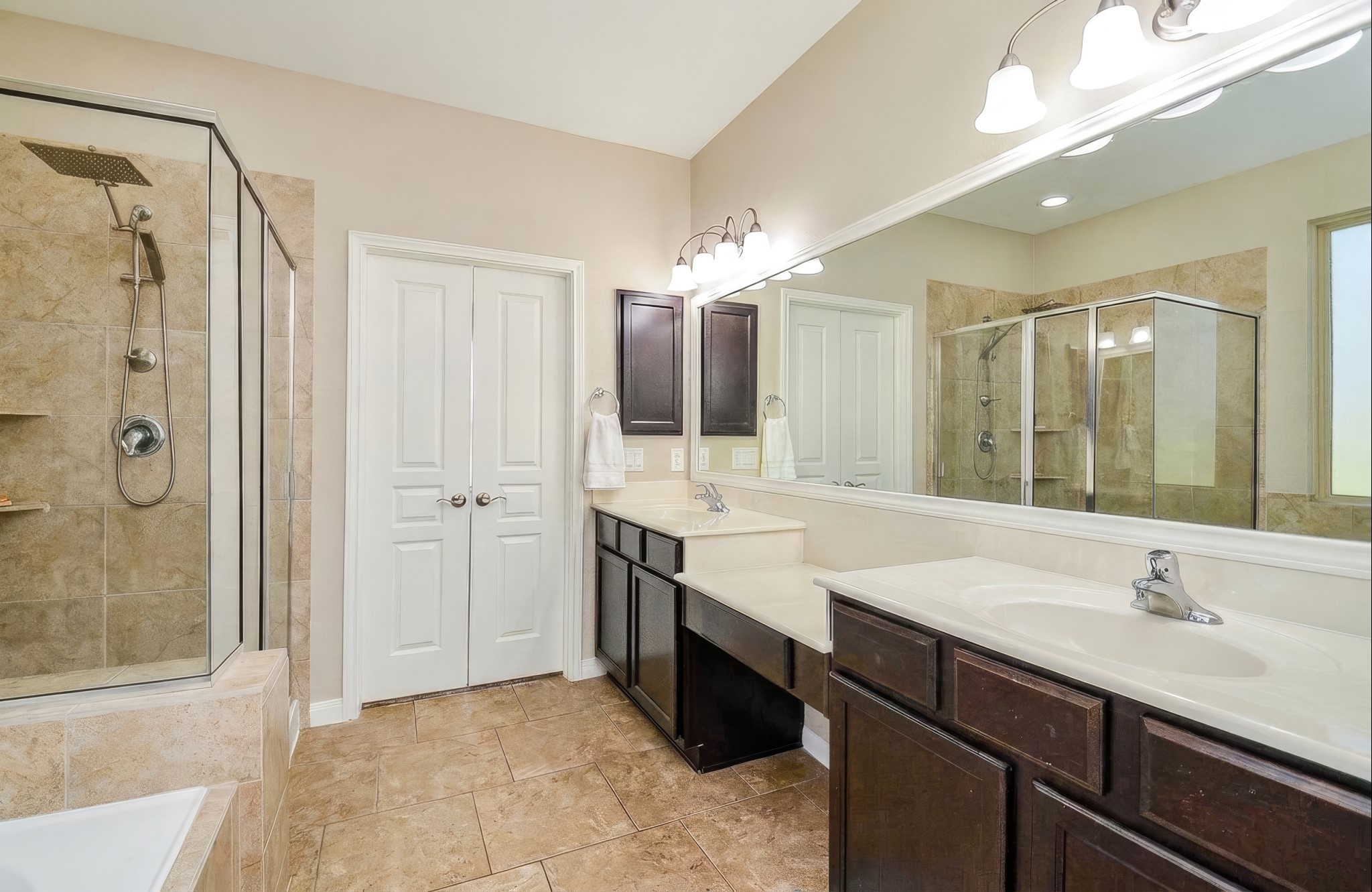 View of the French doors leading into the primary bathroom.