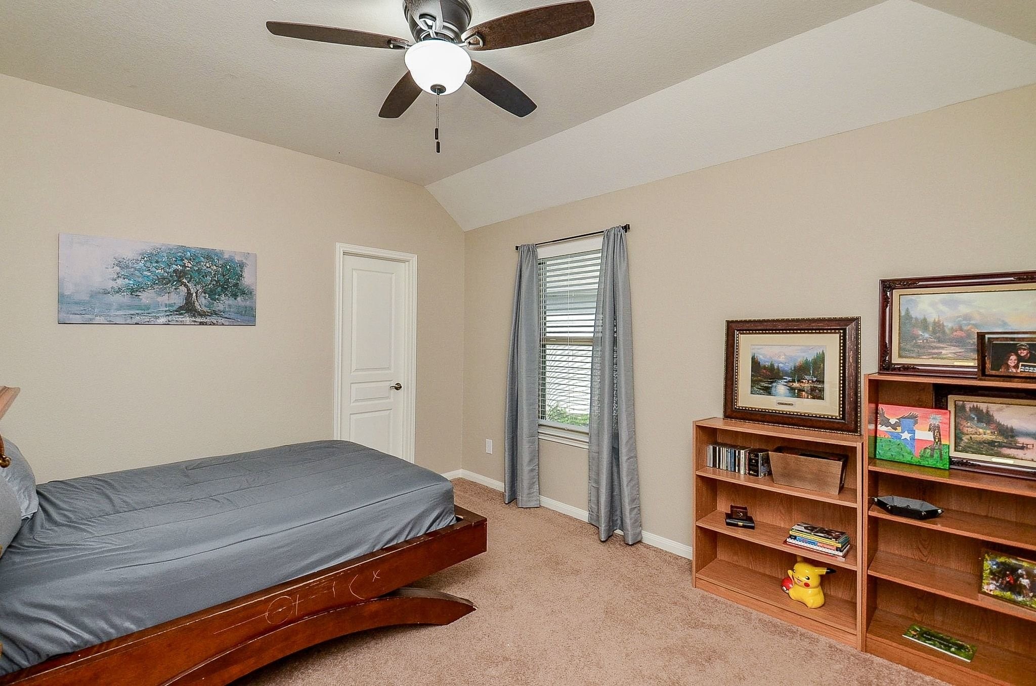 Third bedroom upstairs with its own walk-in closet.