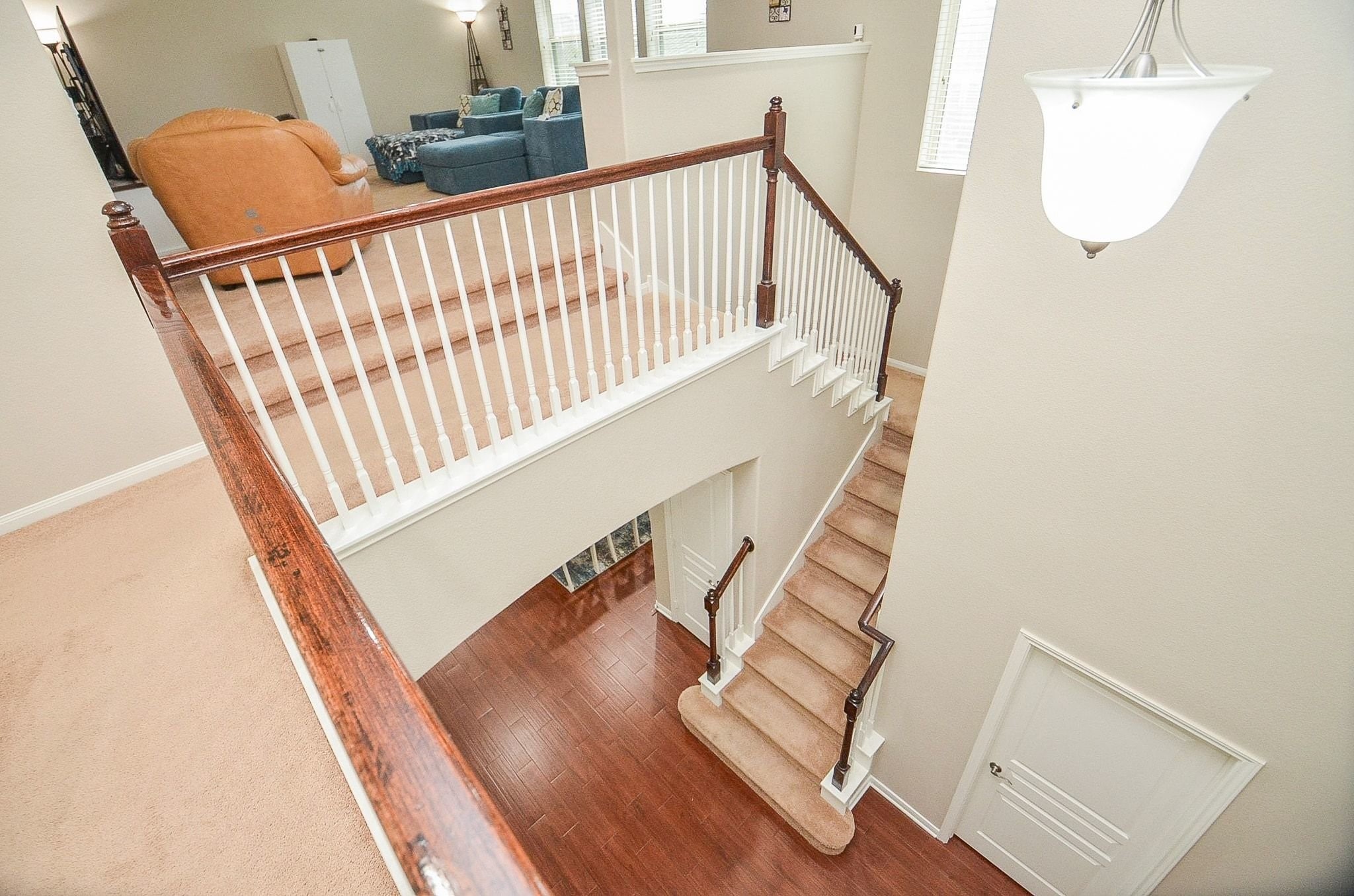 View of the stairwell from the upstairs balcony.