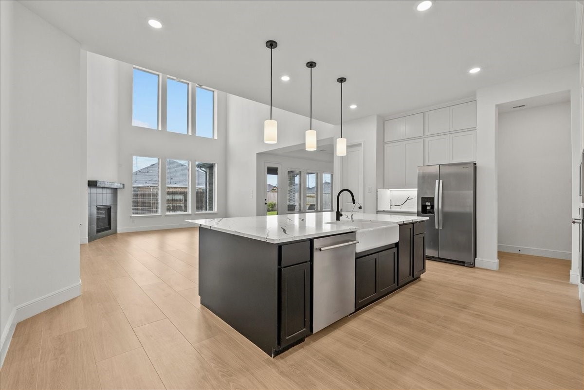 Kitchen opens seamlessly to the inviting living room