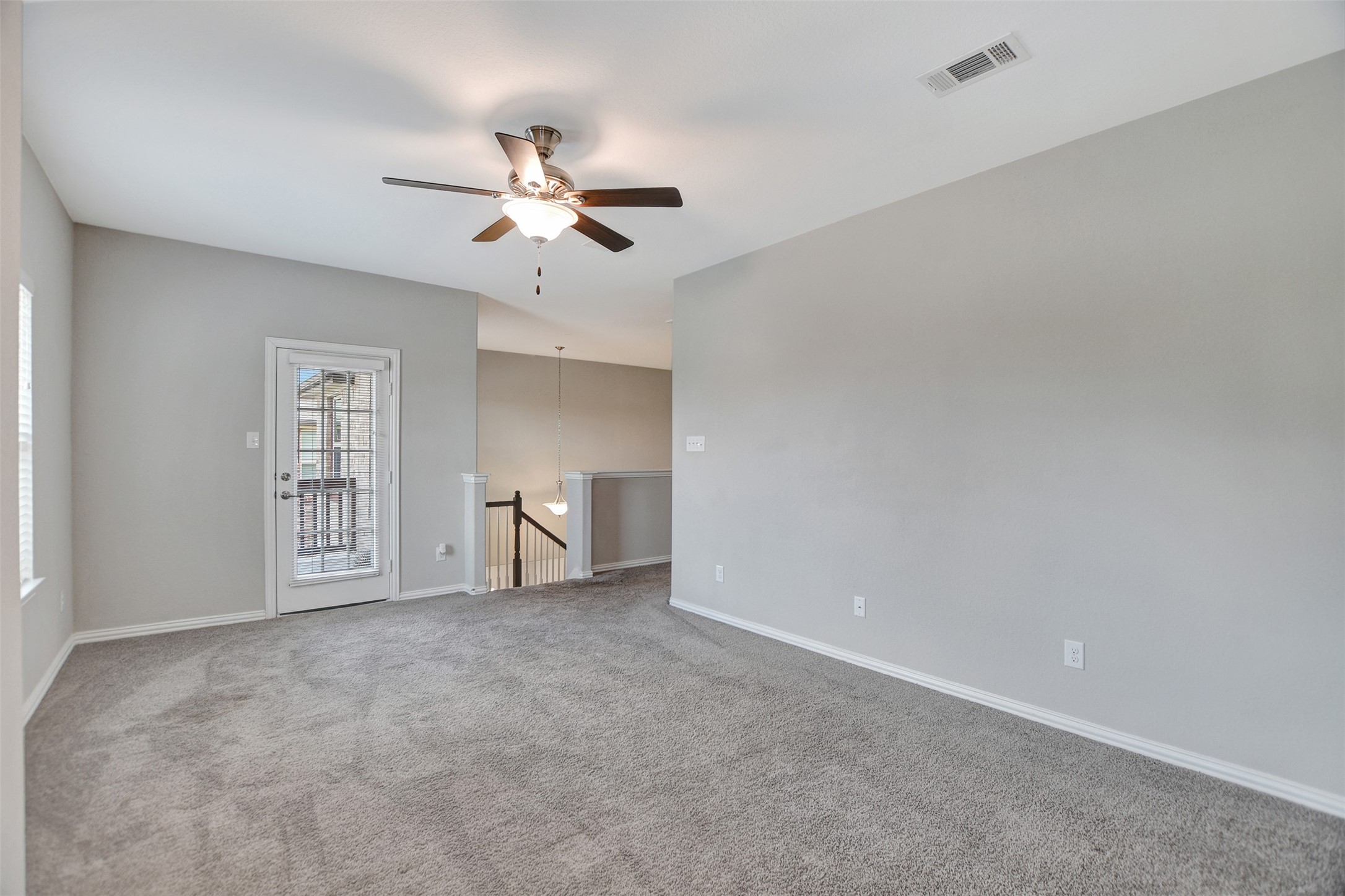 Gameroom has access to the front balcony.