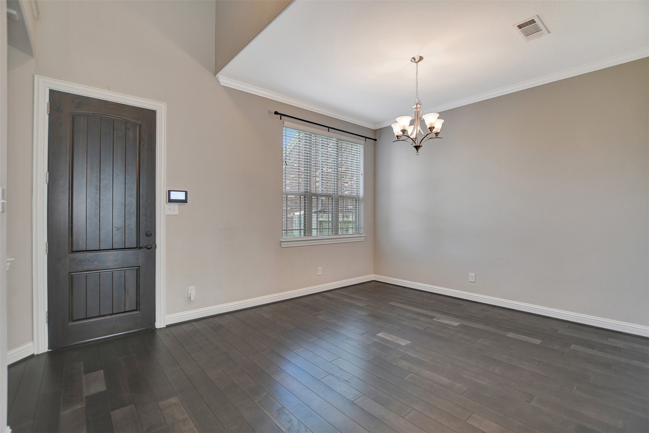 Beautiful hardwood floors welcome you in to this home. This home includes 11 ft ceilings and 8 ft interios doors.