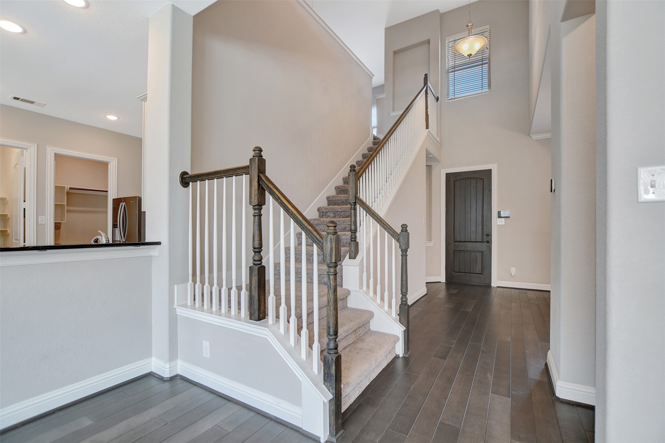 Side stairs take you to all bedrooms and gameroom.