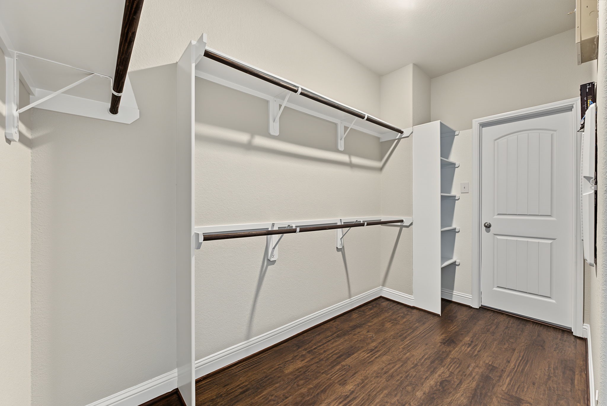 The primary closet just off the bathroom connects directly to the laundry room. The primary closet just off the bathroom connects directly to the laundry room.