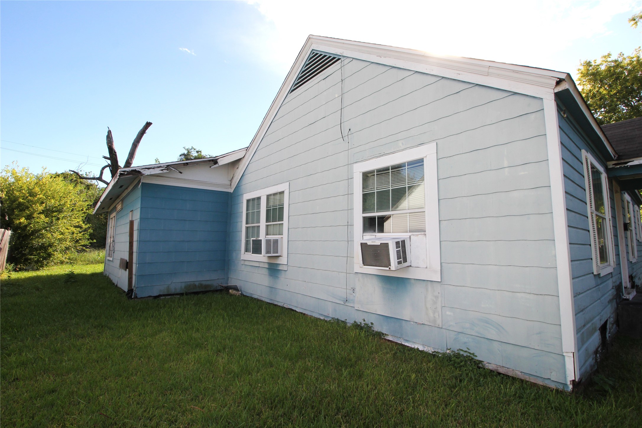 Side of front house with unit 2 in the background