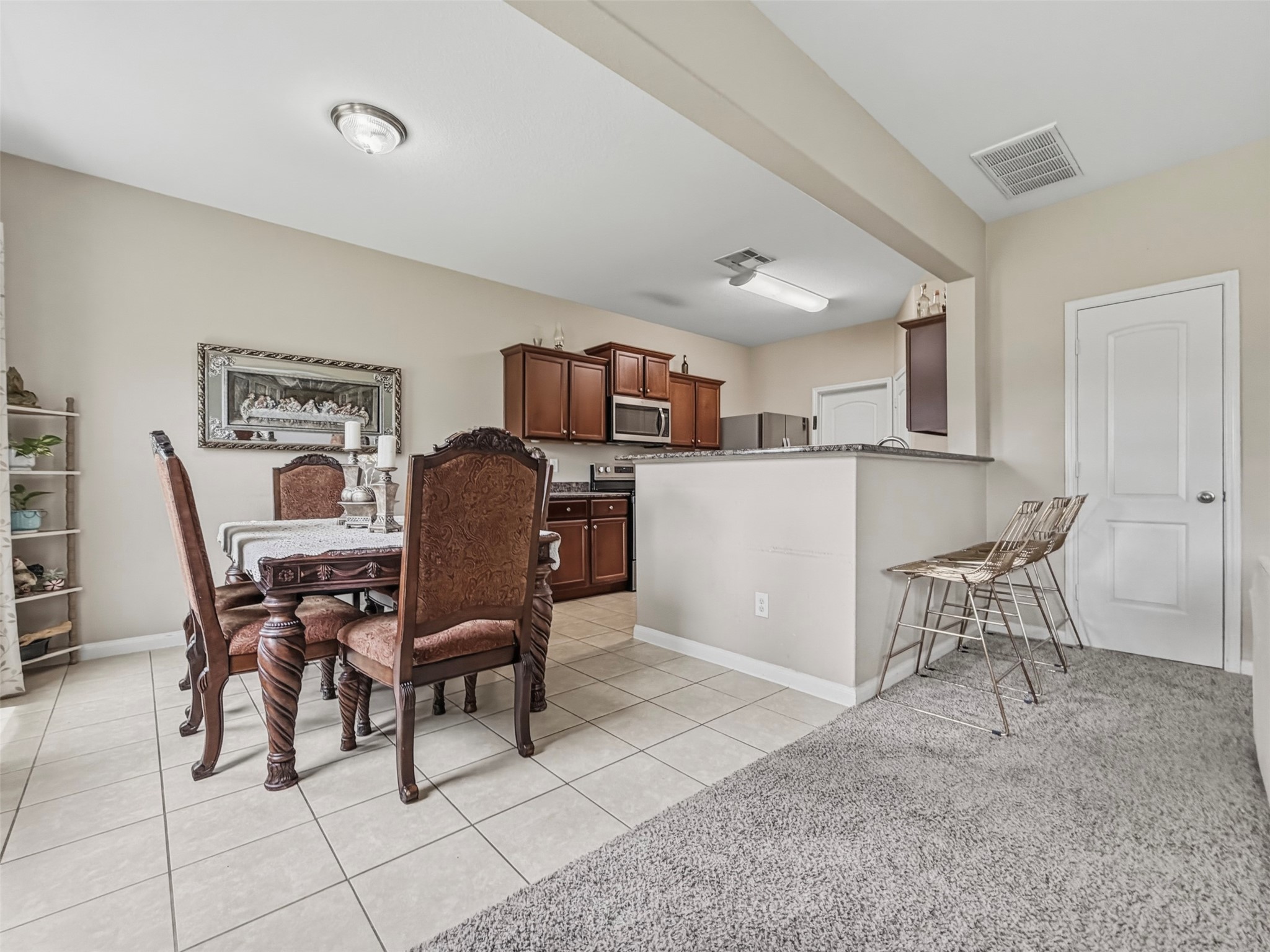 The Dining Room and Kitchen are directly behind the Living Room. The Dining Room and Kitchen are directly behind the Living Room.