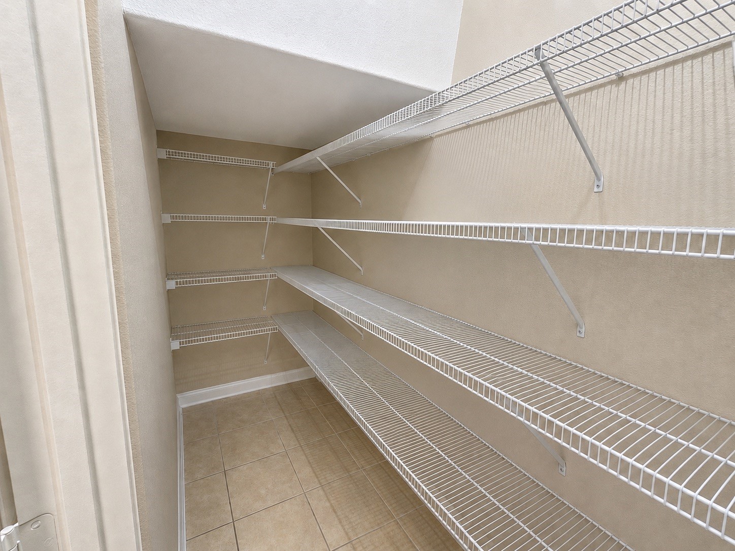 A view of the cleared pantry, which more clearly displays the large amount of storage space it provides.
