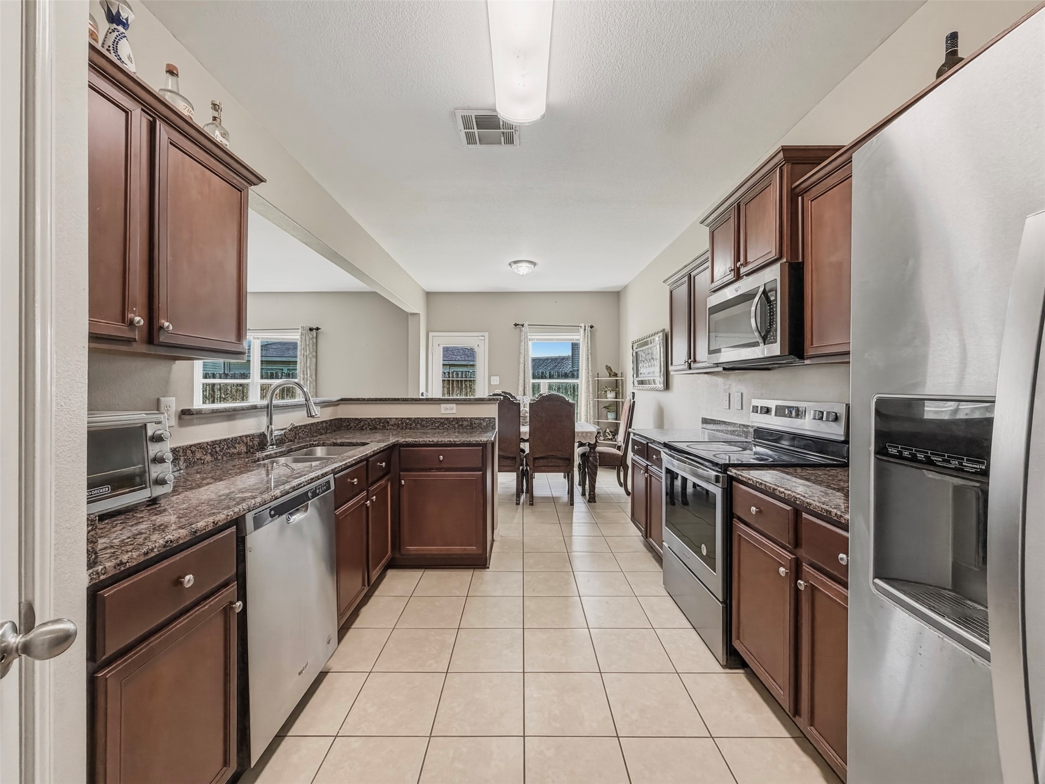 Granite Countertops, Stainless Steel appliances, and a nice amount of cabinet space in the Kitchen.