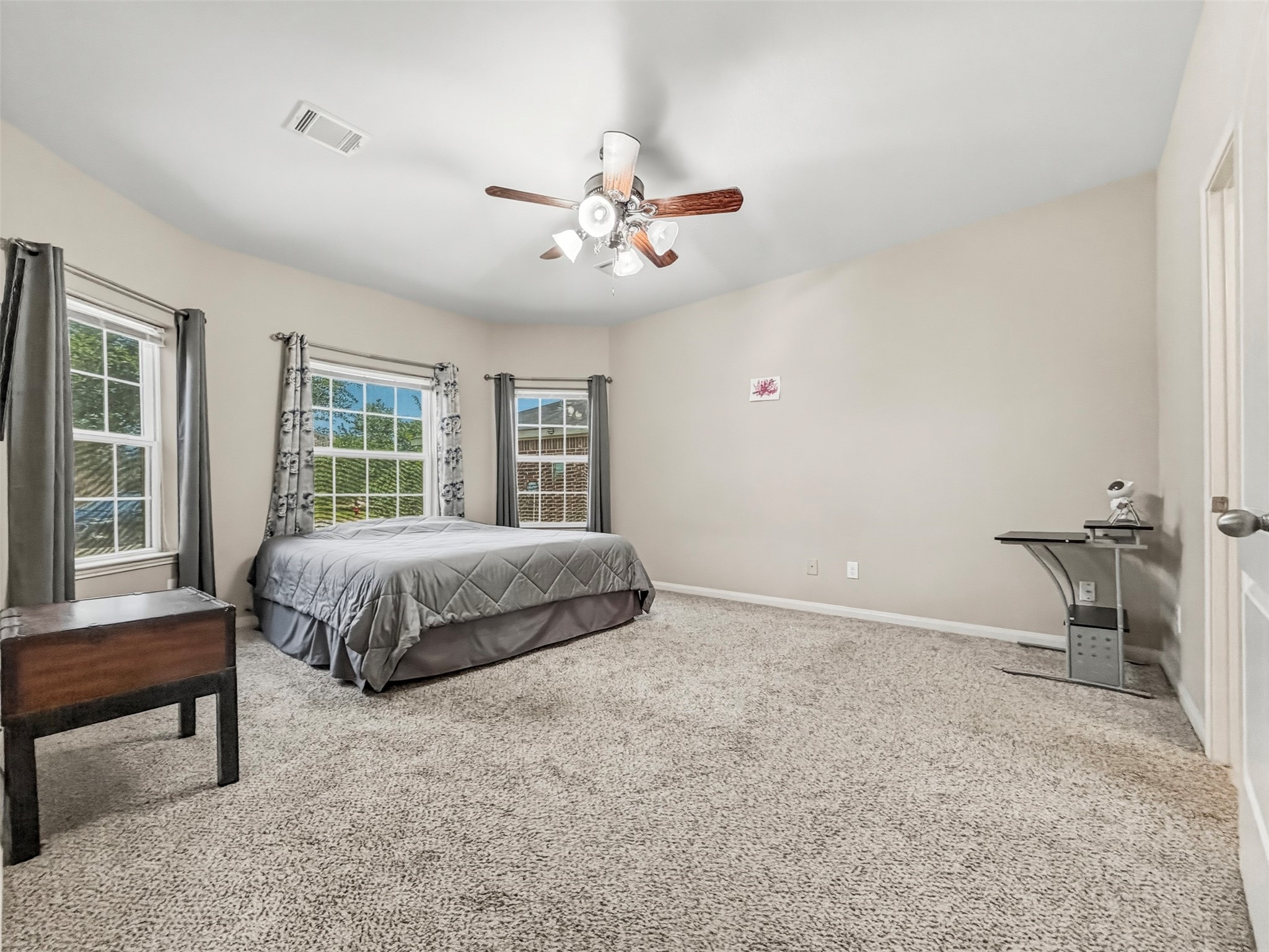 The spacious Primary Bedroom is situated on the first floor away from the other 3 bedrooms located upstairs.