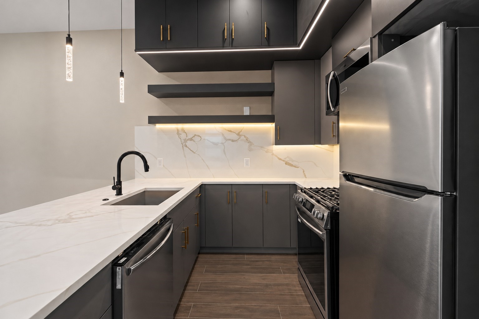 Virtually Staged: Sleek hardware, integrated appliances, and clean countertop surface area complete this refined, space-efficient design.